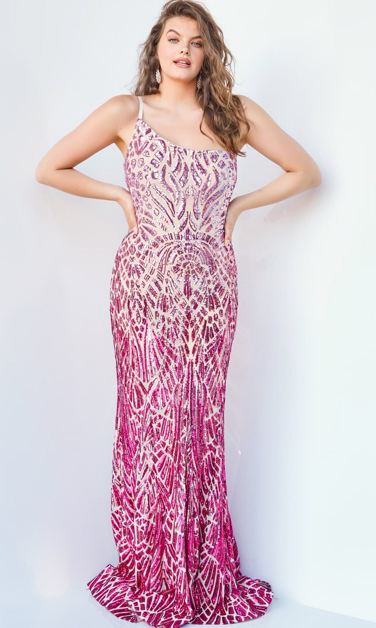 A woman models the Jovani 06469 Ombre Sequin-Print Prom Gown, a sleeveless, fitted pink and white dress with an intricate geometric pattern, standing against a plain white background.